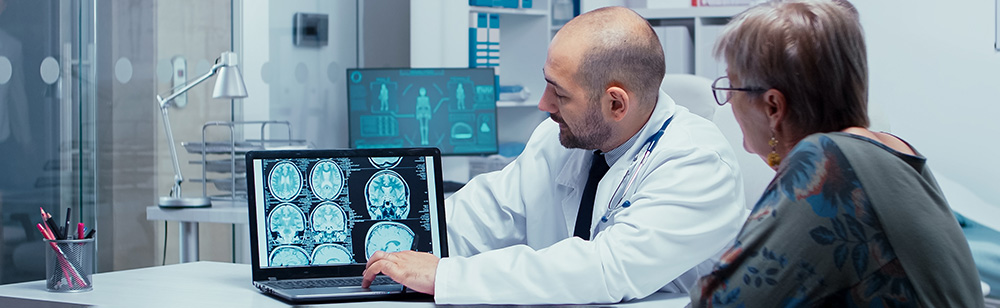 doctor talking with patient about brain scans